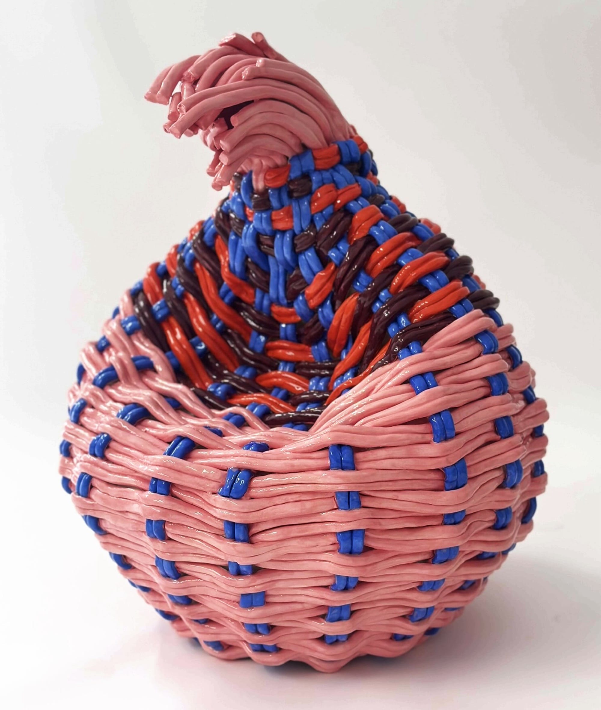 an abstract ceramic sculpture of a woven vessel that has partially crumpled