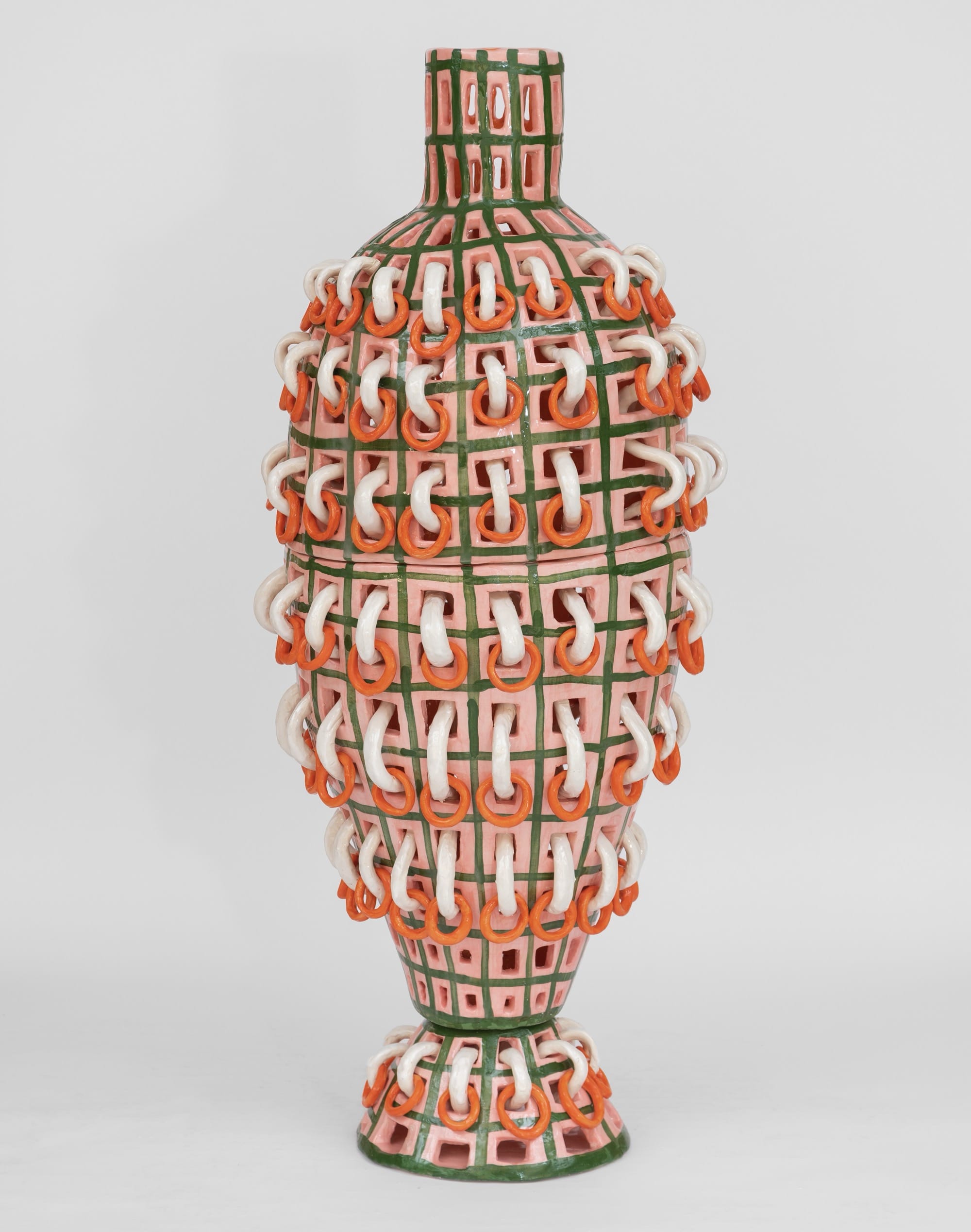 a bright, colorful, large-scale ceramic vessel with white rings creating an overall pattern