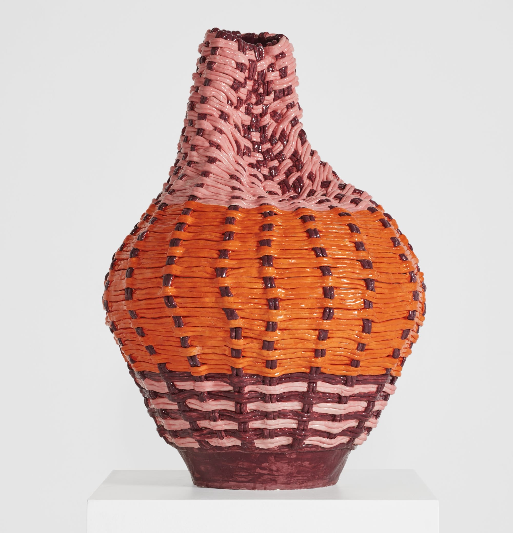 an abstract ceramic sculpture of a woven vessel that has partially crumpled at the top